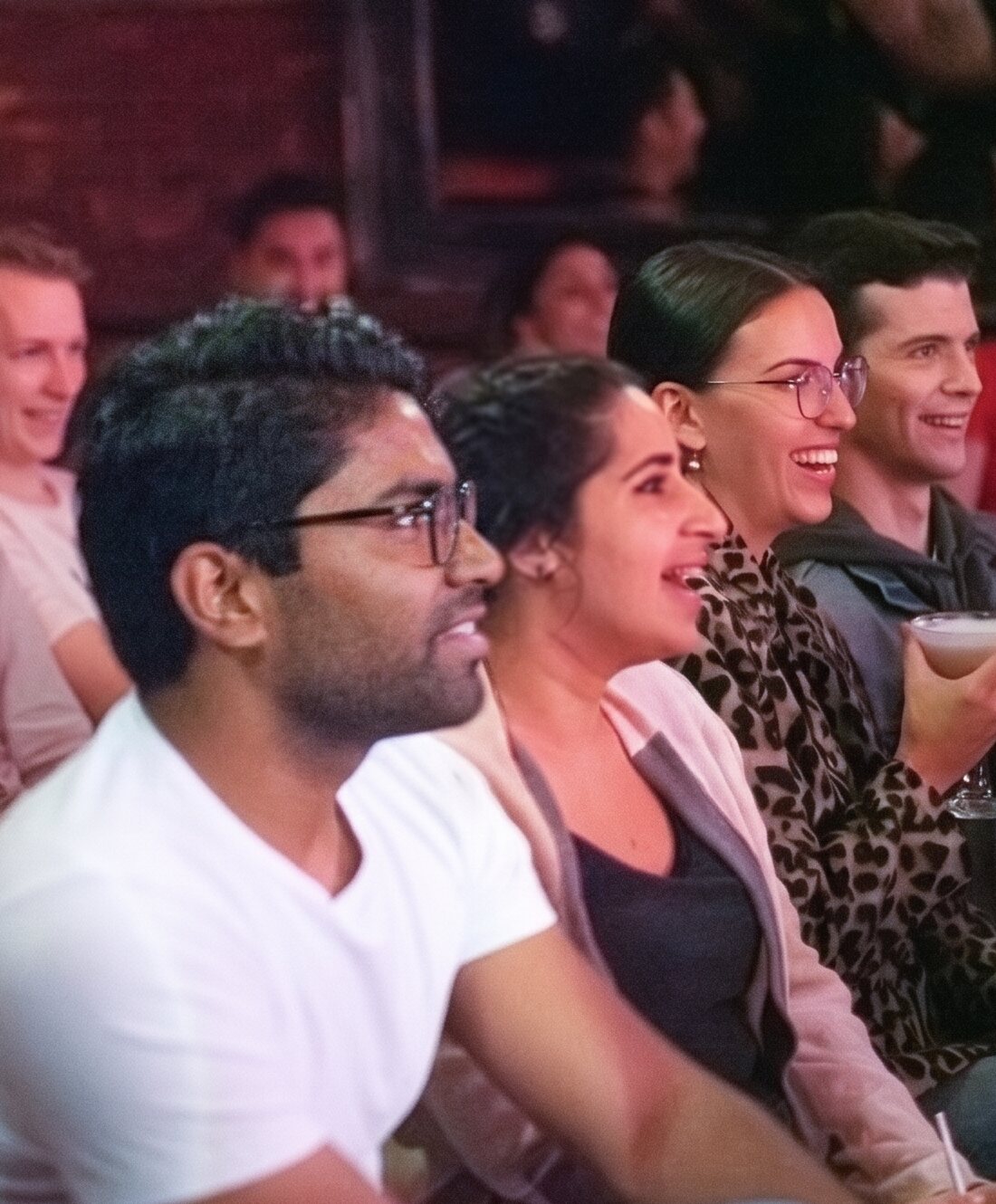 A laughing audience at Totally! Comedy Show at Bar Lubitsch