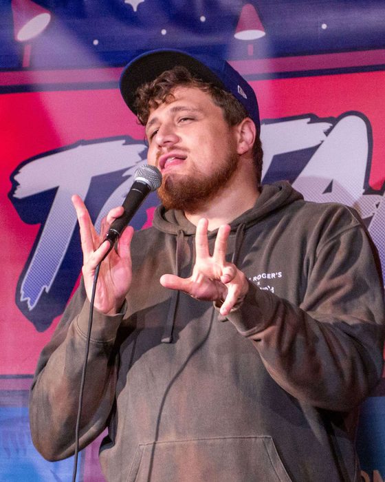 Comedian on stage at Totally! Comedy Show at Bar Lubitsch