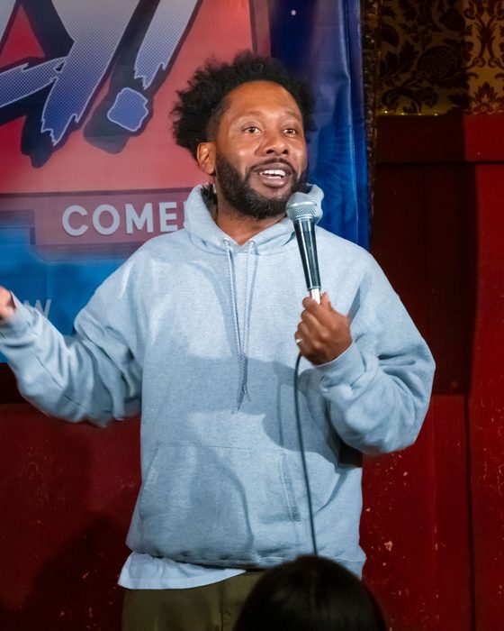 Comedian on stage at Totally! Comedy Show at Bar Lubitsch