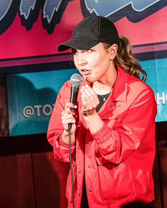 Comedian on stage at Totally! Comedy Show at Bar Lubitsch
